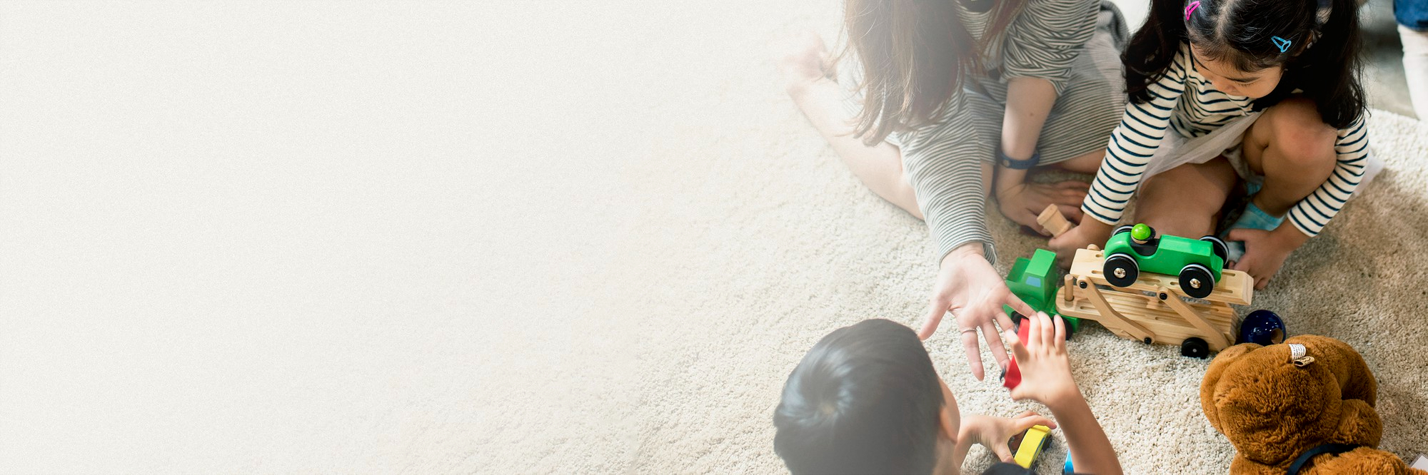 family-playing-with-toys-floor-design-space-parents-and-carers