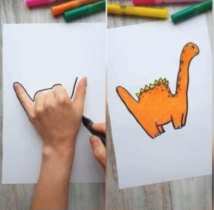 dinosaur drawn by drawing around the hand on the paper