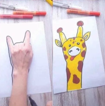 giraffe drawn by drawing around the hand on the paper