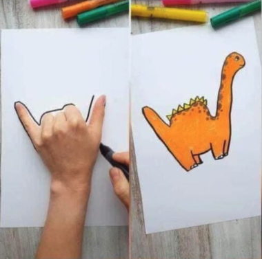 dinosaur drawn by drawing around the hand on the paper