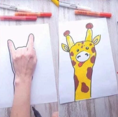 giraffe drawn by drawing around the hand on the paper